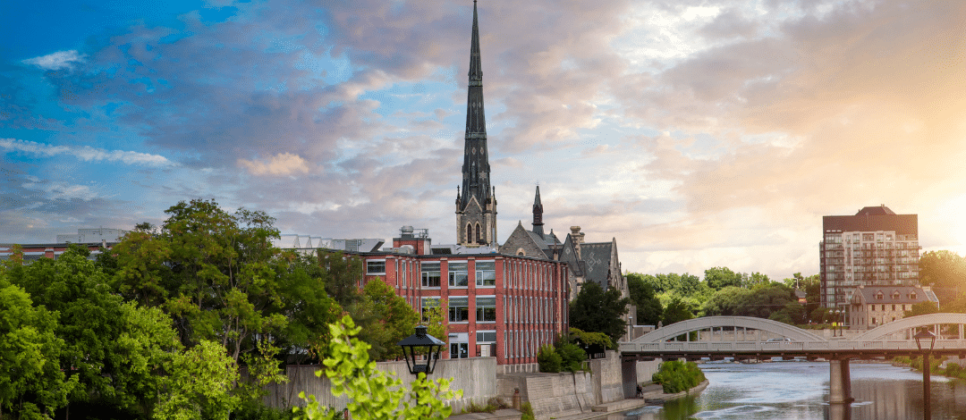 GrandRiver Central Presbyterian Church overlooking the Grand River and Main Street bridge representing Lux Furniture Rentals' Grand River Region delivery service area.