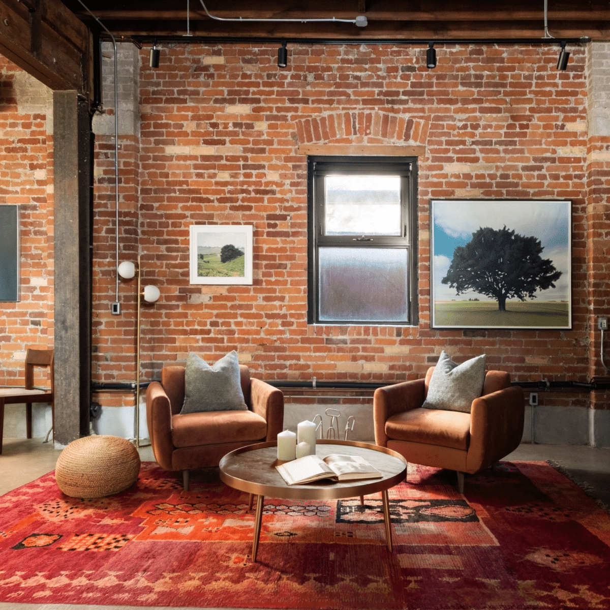 Roncesvalles Loft living room staged with accent chairs and pouf