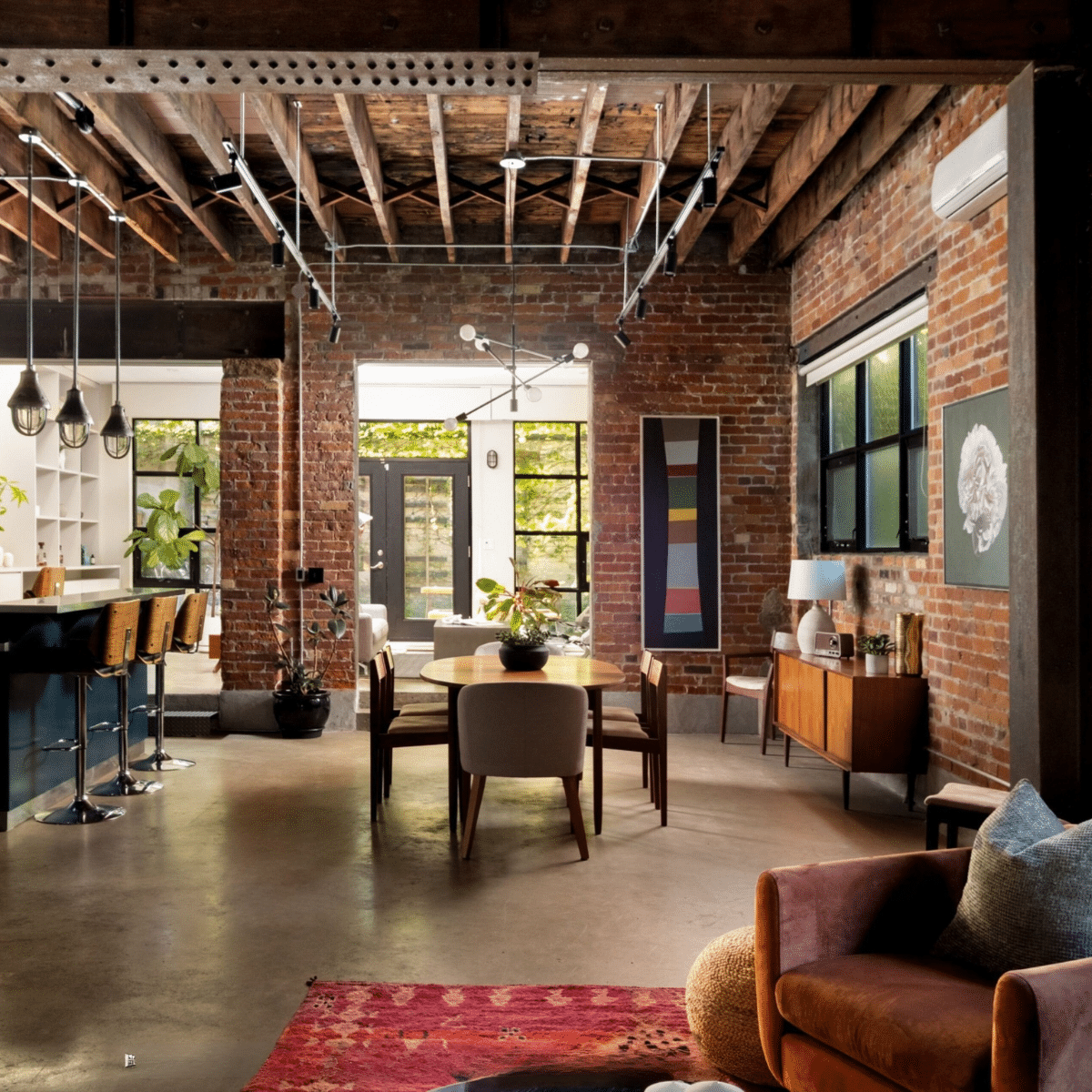 Roncesvalles Loft open concept space staged with dining chairs and accent seating