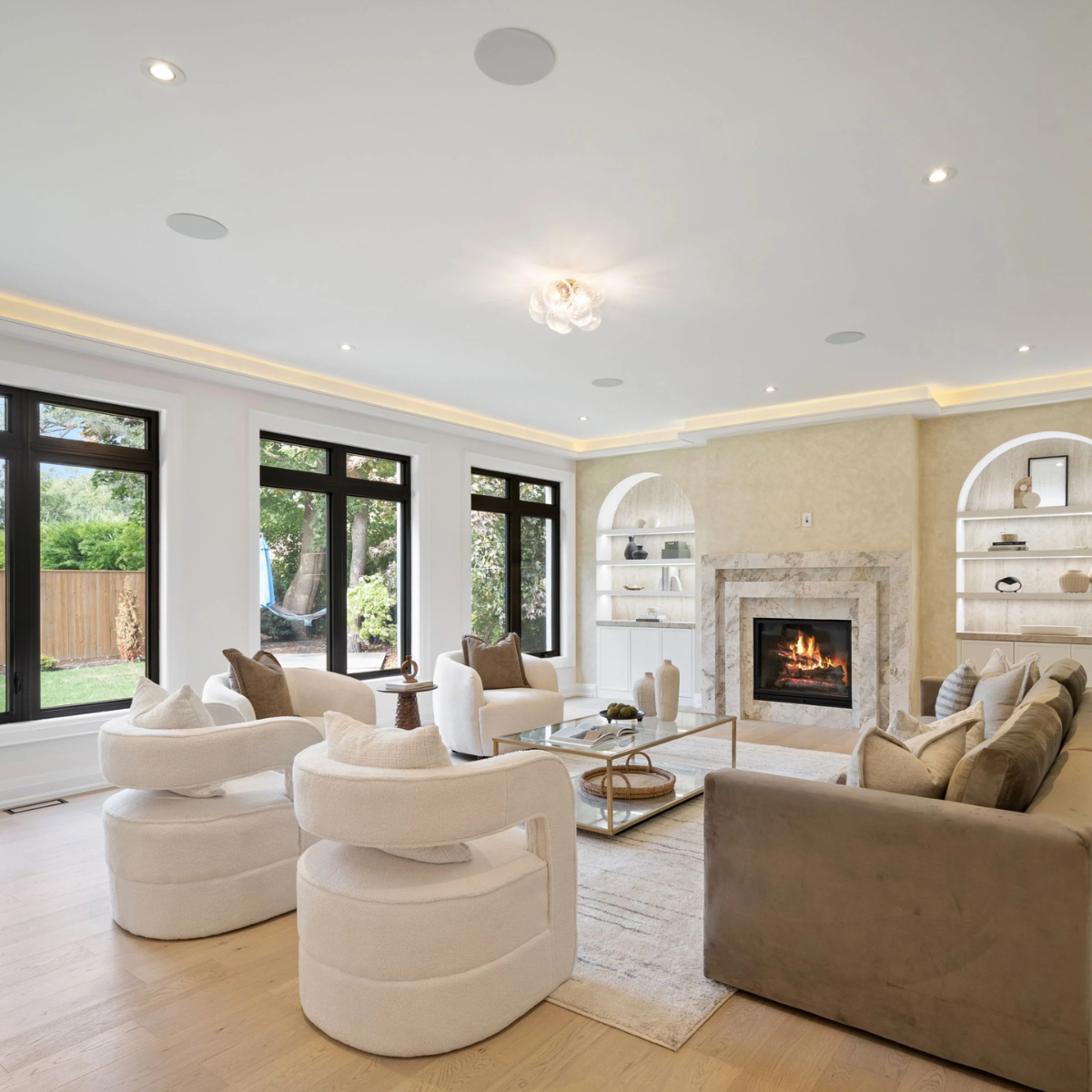 South Oakville Residence family room styled with modular sofa, coffee table and rug