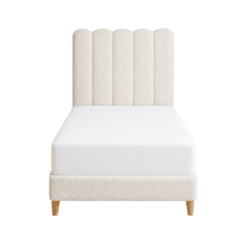 Cream bouclé upholstered twin beds with vertical channel arched headboards for elegant bedroom staging