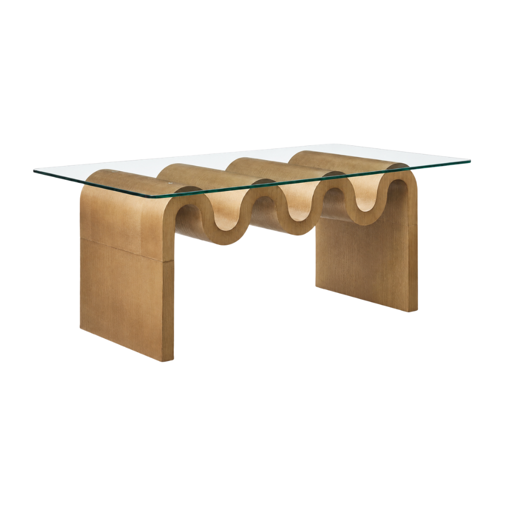 Contemporary light wood coffee table with undulating ripple base and glass top for luxury home staging