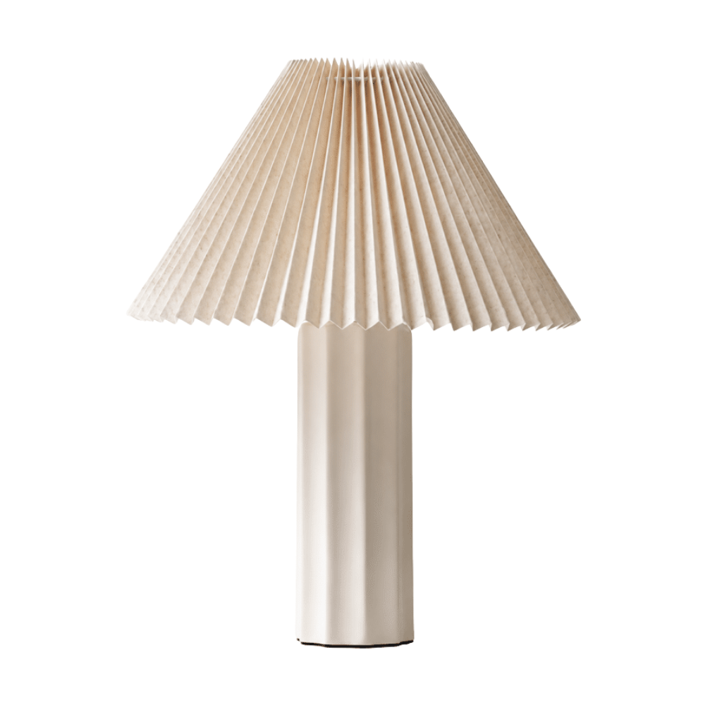 Contemporary table lamp with sculptural off-white base and pleated linen shade
