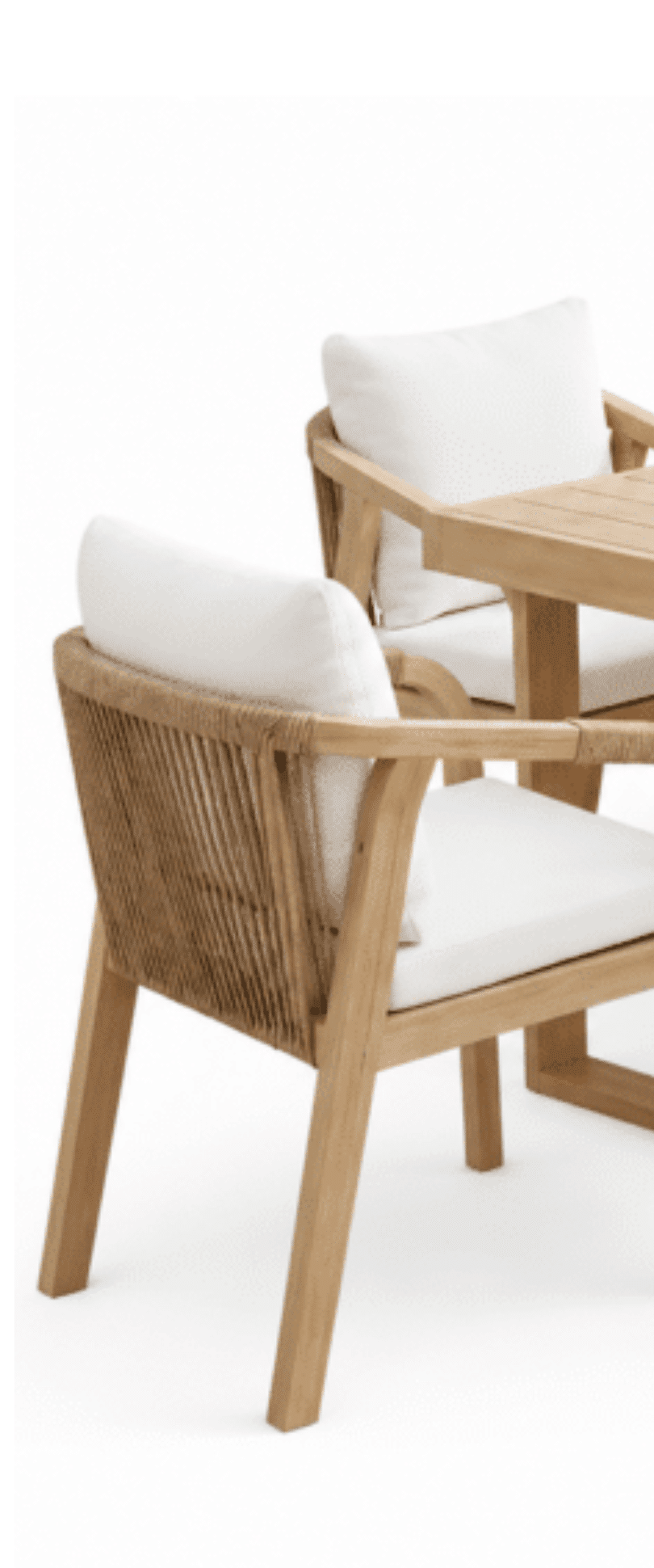 White woven outdoor lounge chair with black metal legs and round side table