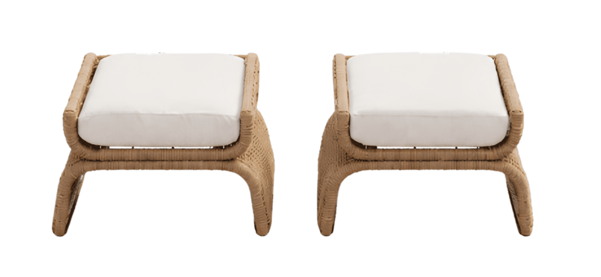Natural wood outdoor dining table with woven-back chairs and white cushions